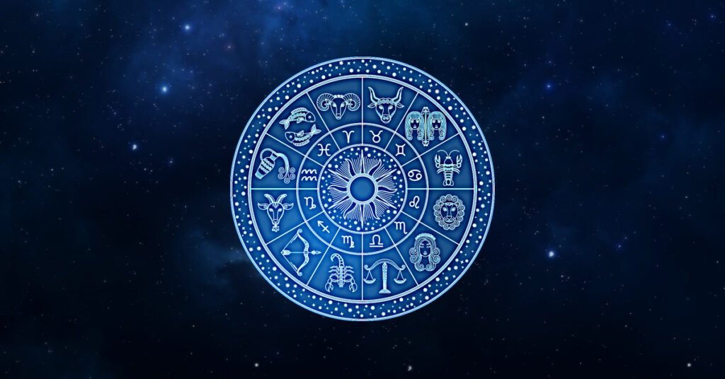 Blue zodiac wheel with glowing astrological symbols on a dark cosmic background