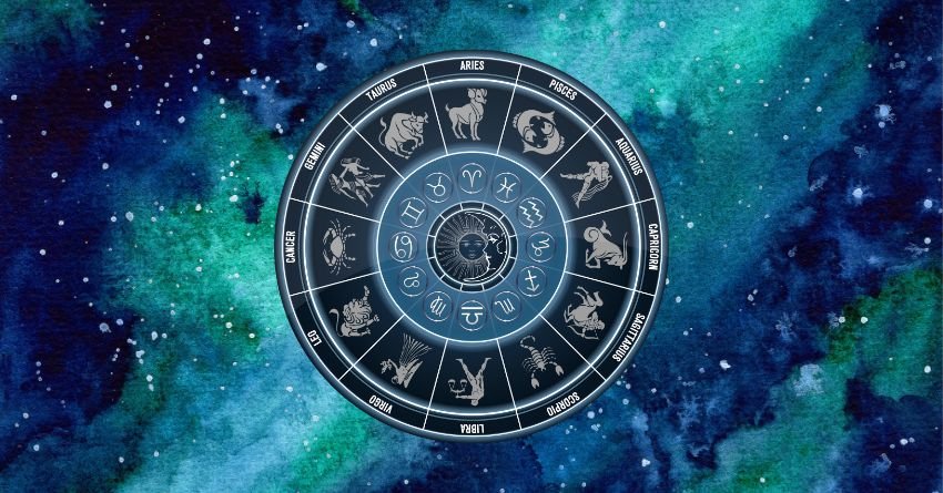 Glowing zodiac wheel with astrological symbols surrounded by blue and green cosmic clouds