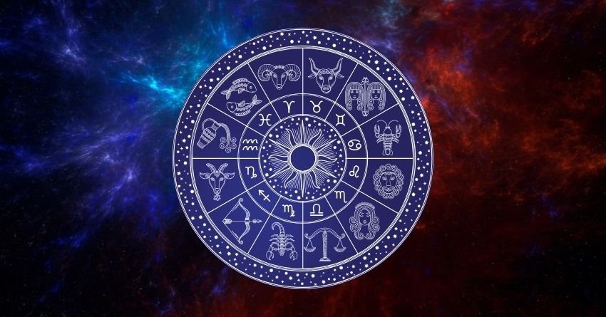 Glowing blue and purple zodiac wheel with astrological symbols on a dark cosmic background