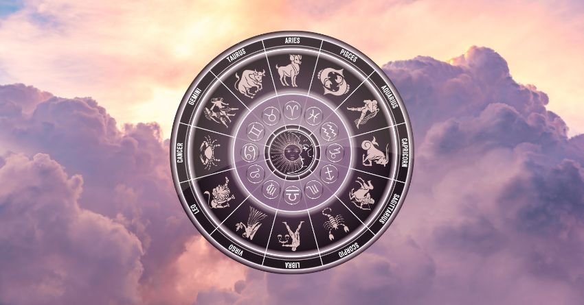 Glowing zodiac wheel with astrological symbols floating above soft pink and purple clouds