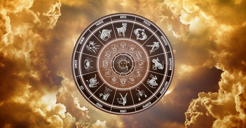 Glowing zodiac wheel with astrological symbols surrounded by golden clouds and warm celestial light