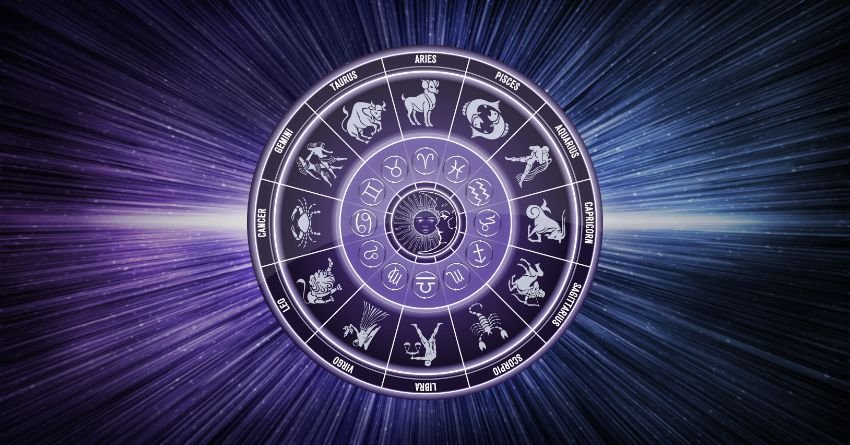 Purple zodiac wheel with astrological symbols against a glowing cosmic background