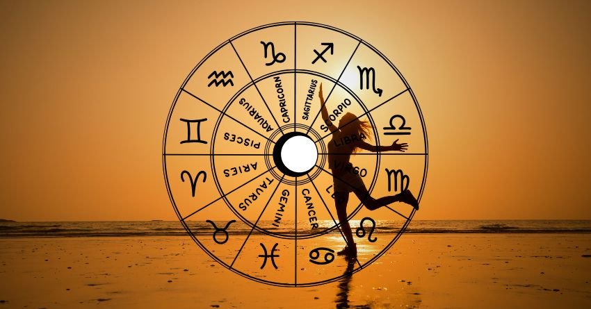 Golden zodiac wheel with astrological symbols and a silhouetted figure against a warm orange background