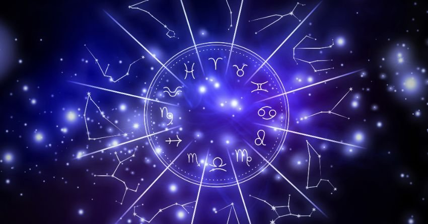 Blue zodiac wheel with glowing astrological symbols and stars