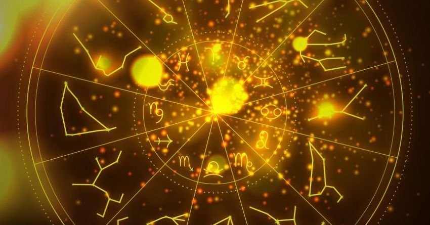 Glowing golden zodiac wheel with bright celestial energy and astrological symbols on a dark cosmic background